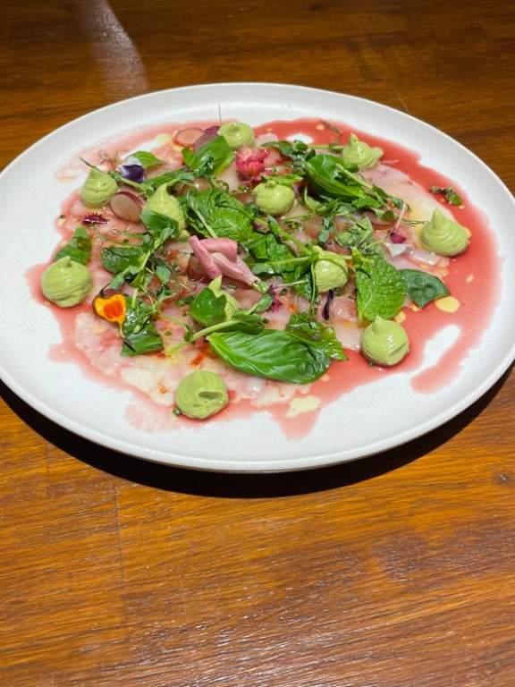 Menu of Restaurants in Albires, CRIOLLO Restaurante, Carpaccio de gambas con vinagreta de granada, hierba buena, uva y aguacate