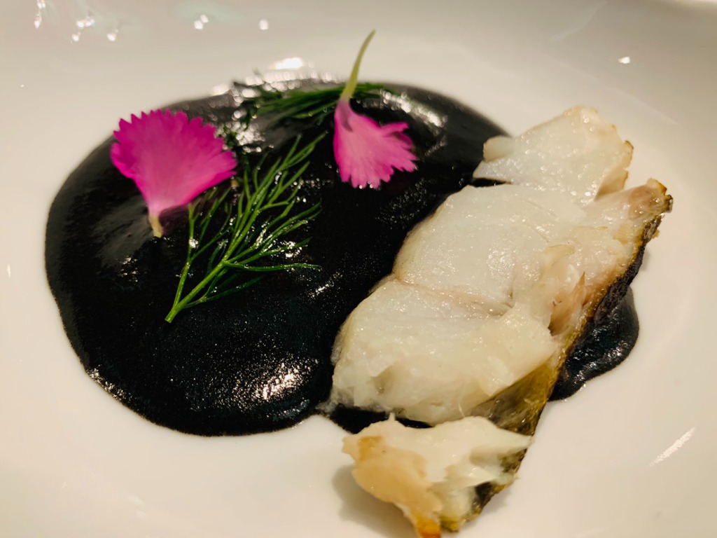 Menu of Restaurants in Barcelona, Fishology Restaurant, Bacalao salvaje a la brasa con tinta de calamar y su versión de micuit de foie gras.