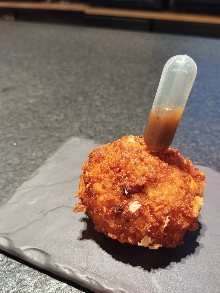 Menu of Restaurants in Pamplona, Bar Ulzama, Croqueta de liebre escabechada con rebozado de panko y corn flakes.